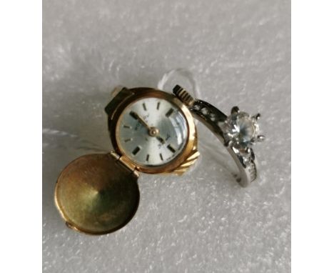 A lady's 9ct gold watch ring, the Rotary watch with engraved hinged cover and tapered fluted shoulders, together with a costu