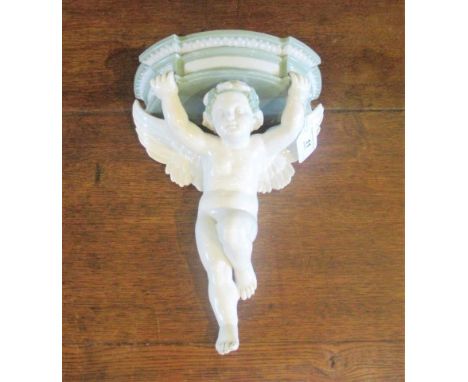 A 19th century Minton sage and white porcelain cherub wall bracket. Condition Report: Overall condition good. Firing crack to