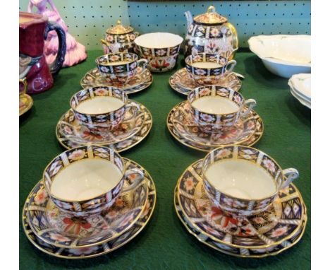 A Royal Crown Derby six sitting tea service, comprising: teapot, sugar bowl, twin handled sugar jug and six trios. Condition 