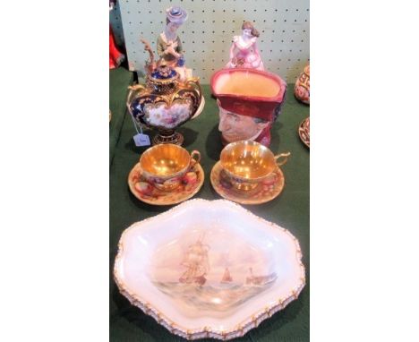 A pair of hand painted dishes, each depicting a seascape and signed W E J Dean, together with a pair of Aynsley cup &amp; sau