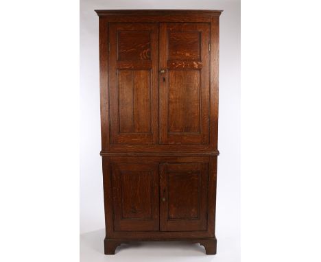 George III and later oak cupboard, the stepped pediment above two fielded panelled cupboard doors opening to reveal later int