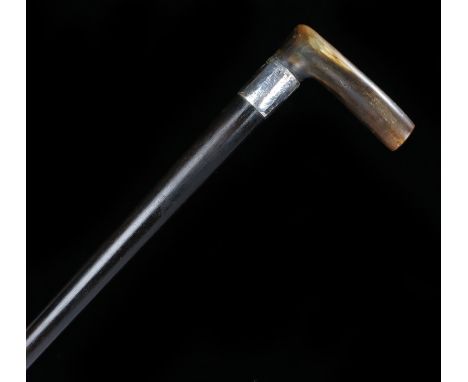 19th Century horn handled walking stick, possibly Rhinoceros horn, the horn handle above a silver collar and tapering stick, 