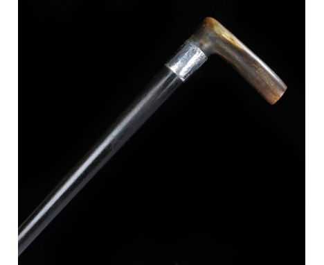 19th Century horn handled walking stick, possibly Rhinoceros horn, the horn handle above a silver collar and tapering stick, 