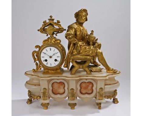 French 19th Century gilt metal and alabaster clock, with a seated figure holding an urn with the dial behind above the alabas