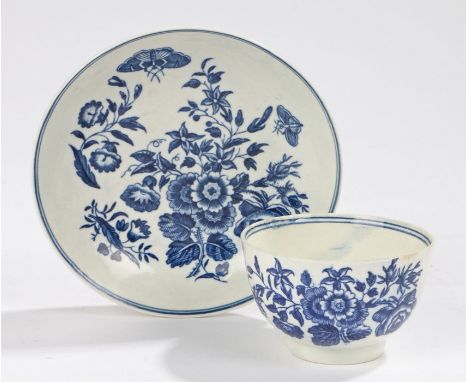 Worcester porcelain tea bowl and saucer, circa1770, painted in the three flowers pattern, with crescent mark to the base on t