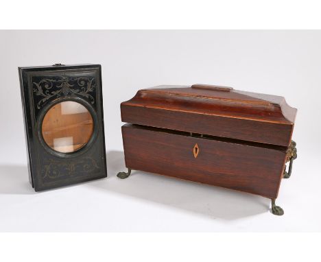 Regency rosewood tea caddy, the sarcophagus body with lion mark handles above paw feet, together with a Victorian ebonised ma