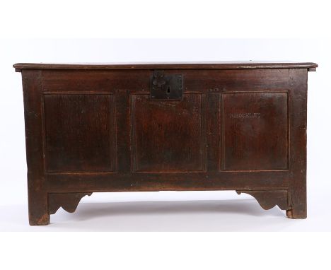 Early 18th Century oak coffer, the rectangular hinged top above a three panel front, one of the panels with the name R. Hocke