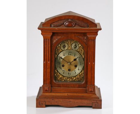 Junghans 20th Century mahogany cased bracket clock and bracket, the arched glazed door flanked by reeded pilasters, the dial 