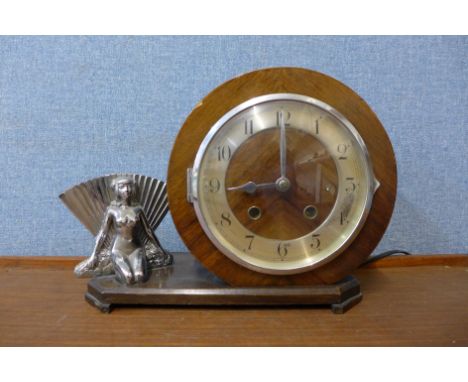 An Art Deco walnut and chrome electric mantel clock 