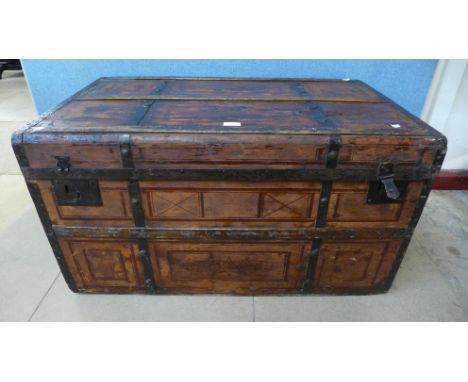 A metal banded steamer trunk 