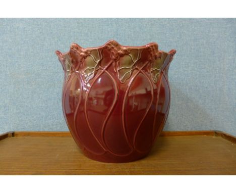 A Blakeney Pottery burgundy jardiniere, L/S Fleur Art Nouveau design 