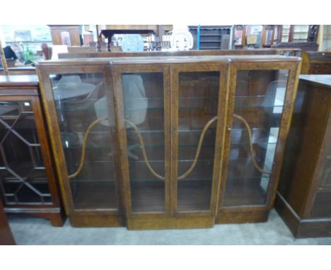 An Art Deco walnut breakfront display cabinet 