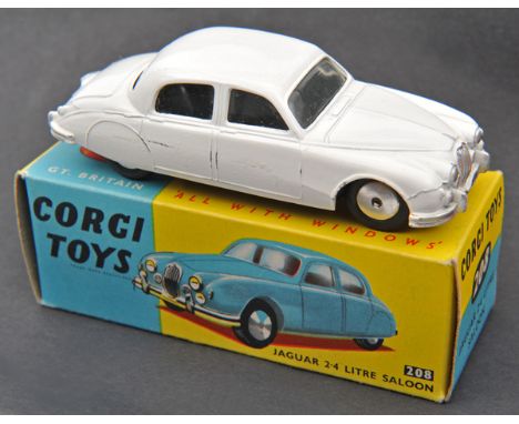 Corgi Toys Jaguar 2.4 litre Saloon (208). An example in white. Boxed. Vehicle VGC light rubbing to raised edges. Plate 4