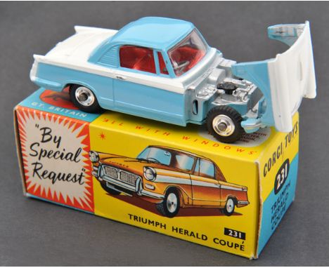 Corgi Toys Triumph Herald Coupe (231). Example in white and light blue with red interior. Example with shaped wheels. Boxed, 