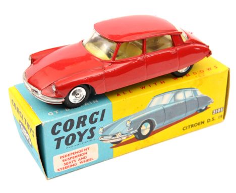 Corgi Toys Citroen D.S.19 (210S). An example with suspension, in red with yellow interior. Boxed, minor wear. Vehicle Mint. P