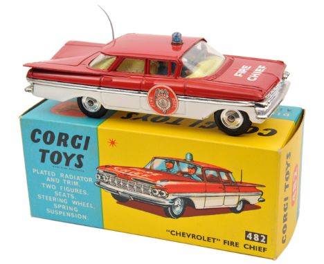 Corgi Toys Chevrolet Impala Fire Chief (482). With red over white body with chrome stripe, yellow interior, light to roof, ro