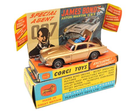 Corgi Toys James Bond’s Aston Martin D.B.5 (261). 1st type in metallic gold with red interior. Boxed with display insert, 2 s