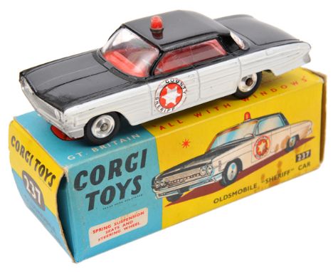 Corgi Toys Oldsmobile Super 88 ‘Sheriff’ Car (237). In black and white with red interior, ‘County Sheriff’ to front doors.Box