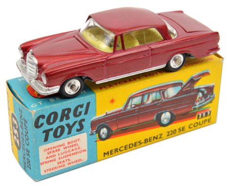 Corgi Toys Mercedes-Benz 220SE Coupe (253). An example in metallic maroon with yellow interior. Complete with luggage. Boxed.
