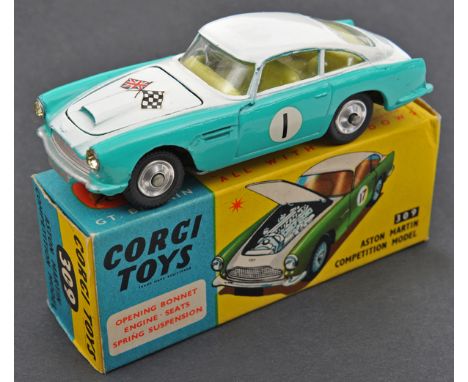 Corgi Toys Aston Martin Competition Model (309). In white and turquoise with yellow interior, crossed flags to bonnet, RN1. B