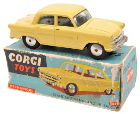 Corgi Toys Standard Vanguard 111 Saloon (207M). A scarce mechanical example in all over lemon yellow. In early blue box, worn