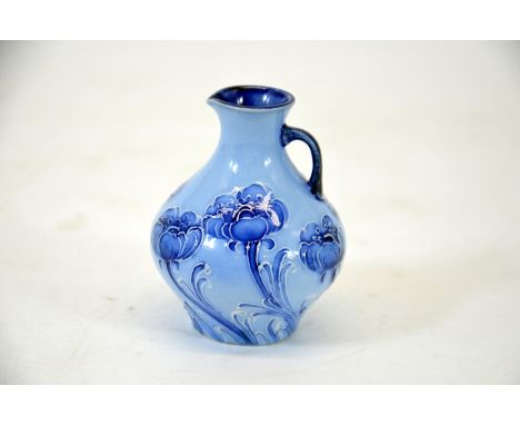 William Moorcroft for James Macintyre, poppy blue on blue miniature jug, bulbous form, circa 1910, signed, printed marks, hei