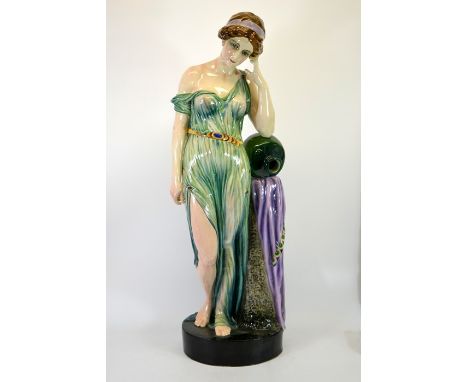 A large Goldscheider figure of Rebecca, circa 1898, resting with water jar against a column, draped in green dress, signed Lo