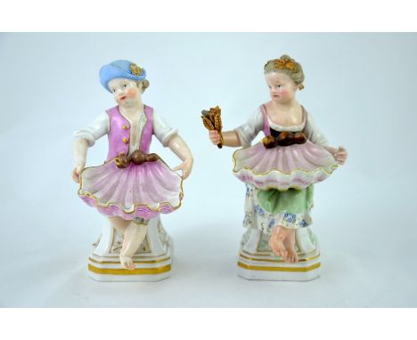 A pair of Meissen figural salt cellars, circa 1880, modelled as pastoral boy and girl on plinths, holding scallop shells, pai