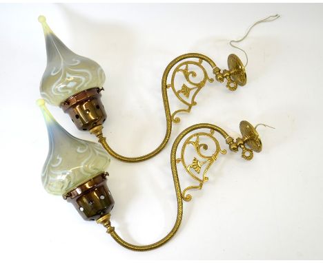 John Walsh Walsh, a pair of Arts and Crafts opalescent glass lamp shades, fitted on Aesthetic movement wall mounted lights, c