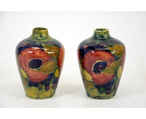 William Moorcroft, a pair of Pomegranate vase's, shouldered form, ochre ground, circa 1911, signed and impressed marks, heigh