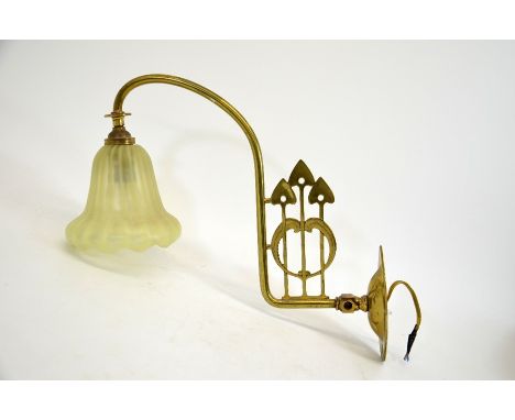 An Arts and Crafts brass and opalescent glass wall light, the straw opal optic moulded shade, probably by John Walsh Walsh, w