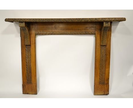 A Victorian oak fire surround, carved with foliate borders and floral motifs, 114cm high, 150cm long