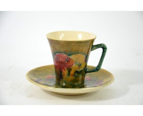 William Moorcroft, a Claremont flared coffee can and saucer with bamboo handle, circa 1910, signed, 7cm high