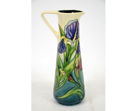 A Moorcroft 1997 Collectors Club jug, with iris decoration and strap handle, by Rachel Bishop, signed to the base John Moorcr