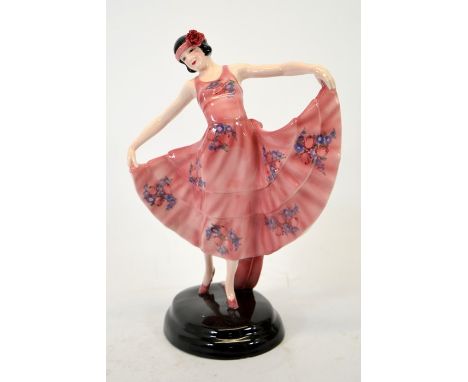 Stephan Dakon for Goldscheider, figure of a dancer, in pink dress, circa 1929, model 6020, wearing a floral head band, painte