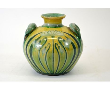 A Della Robbia art pottery vase, twin handled squat amphora form, painted with flowers in the Art Nouveau style, underglaze g