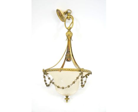 An Edwardian brass and glass pendant light fitting, with domed and star cut frosted shade, 