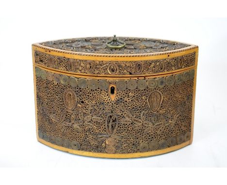 A George III scrollwork tea caddy, lozenge form, circa 1780, satinwood with ebony and boxwood banding, decorated with rolled 
