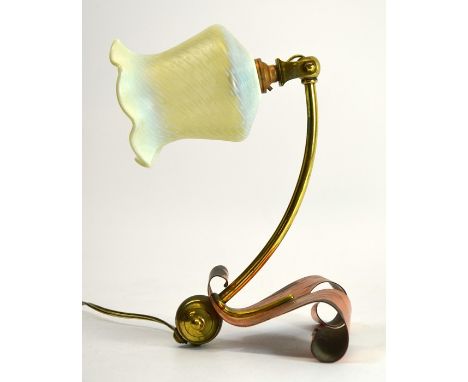 W A S Benson, an Arts and Crafts copper and brass table lamp, model 1288, circa 1900, the bowed arm on a bisected scrolled co