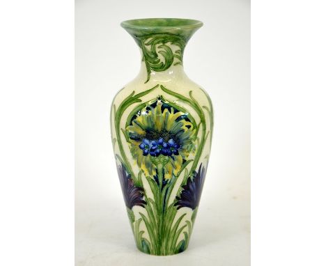 William Moorcroft, a Cornflower vase, baluster form on a white ground, circa 1914, signed, impressed marks, height 22cm,