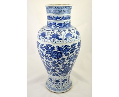 A large Chinese Kangxi blue and white vase, inverse baluster form, decorated with lotus scrolls in the Islamic taste, between