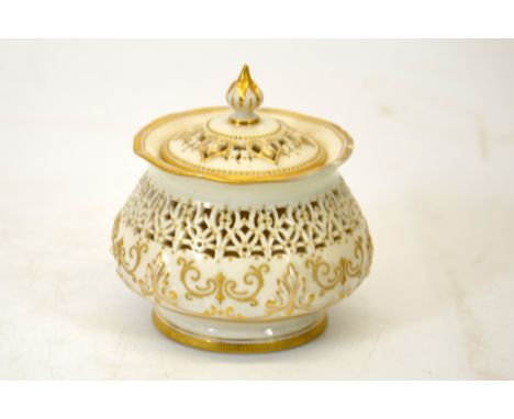 George Owen for Royal Worcester, a reticulated pot and cover, 1911, relief moulded foliate baluster form with band of pierced