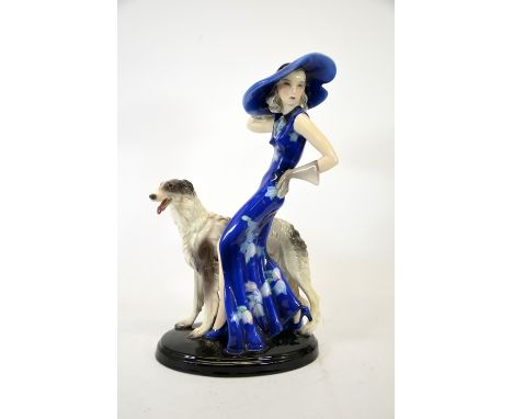 Claire Weiss for Goldscheider, figure of a woman with Borzoi, circa 1936, model 7367, blue floral dress and hat, incised CW t