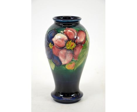 Walter Moorcroft, a Clematis vase, baluster form, blue ground, circa 1948, signed and impressed marks, height 18cm