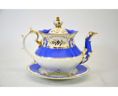 A Rockingham blue teapot on stand, pattern 2 75, relief moulded baluster form with crown finial, gilt highlighted, 26cm long 