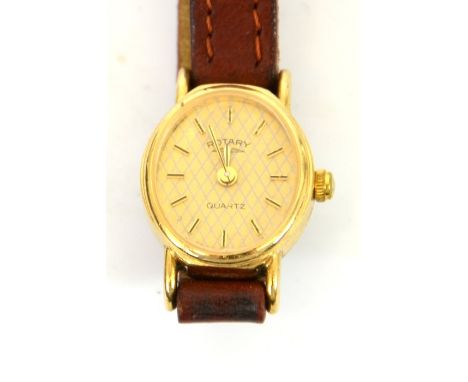 Rotary ladies watch, oval faced rotary quartz movement watch, 9ct yellow gold (stamped 375) with brown 8mm wide strap