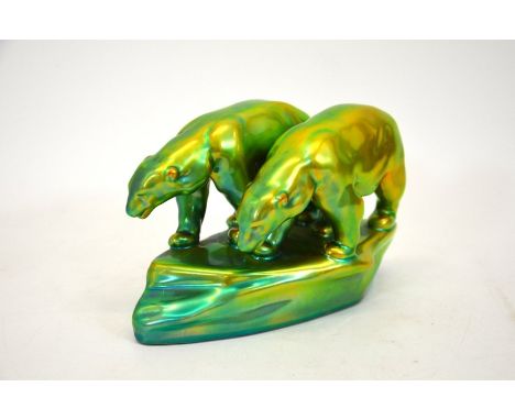 A Zsolnay Art Deco eosin polar bears figurine, green and yellow iridescent glaze, circa 1960, 13cm high