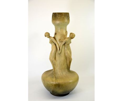 J Louger for Goldscheider, a large Art Nouveau figural vase, circa 1900, bulbous form, modelled in relief with three female f