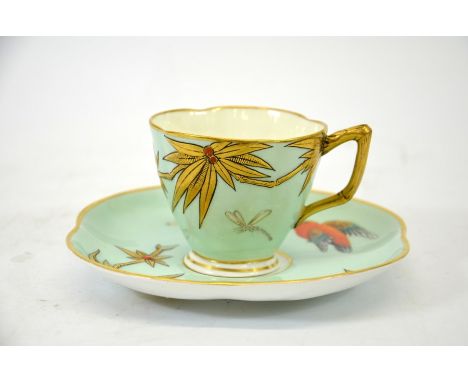 John Hopewell for Royal Worcester, an Aesthetic Movement cup and saucer, circa 1874, decorated in relief with birds and bambo