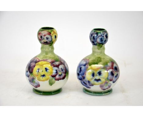 William Moorcroft for James Macintyre, a pair of Pansy on white ground vases, knop necked form, circa 1910, signed, printed m